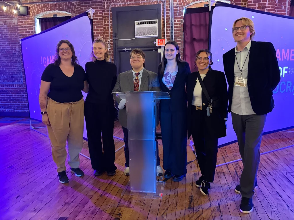Six attendees on stage at the CAPT–GRAIL Summit
