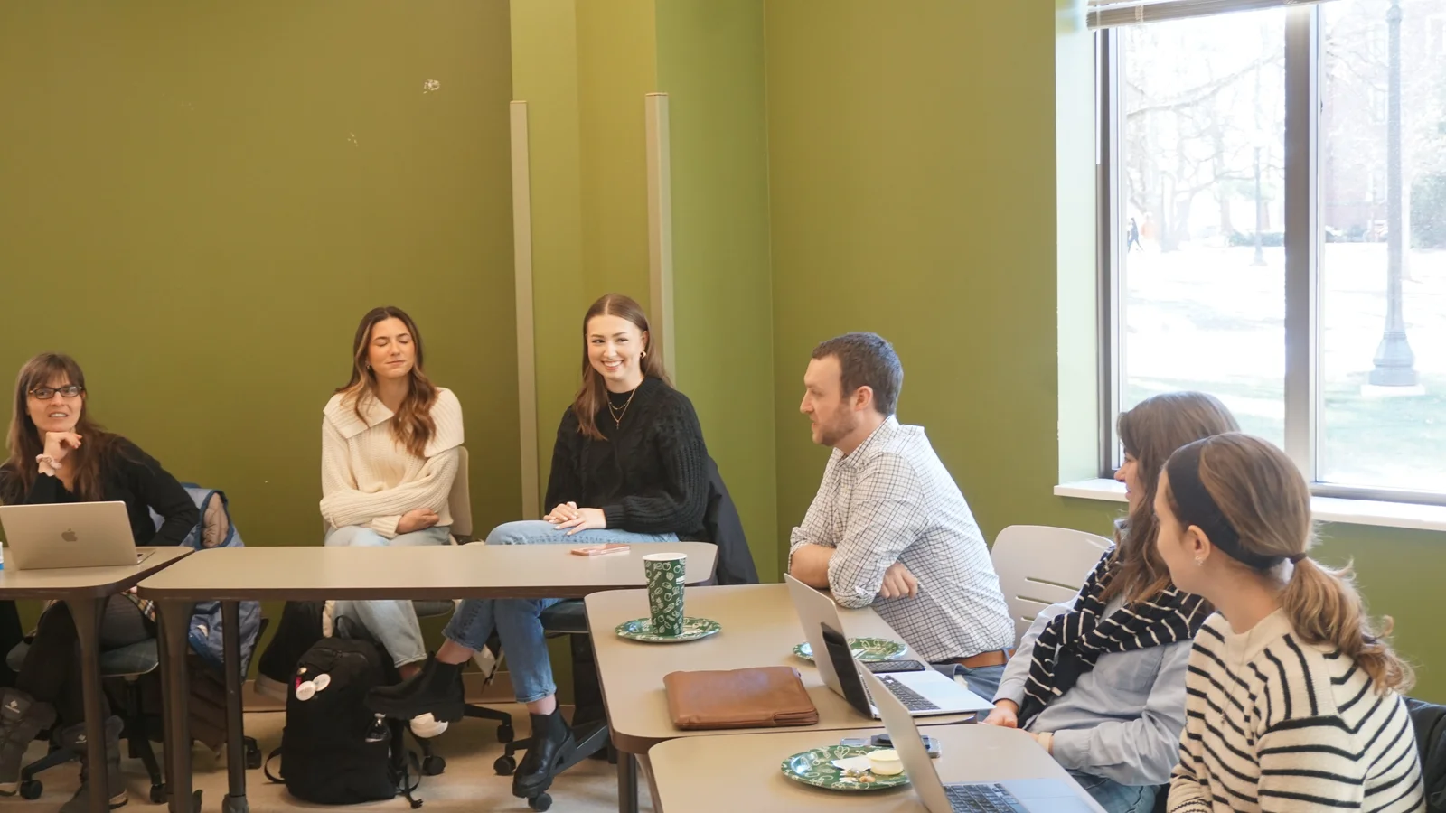 GRAIL colleagues talking at a lab meeting