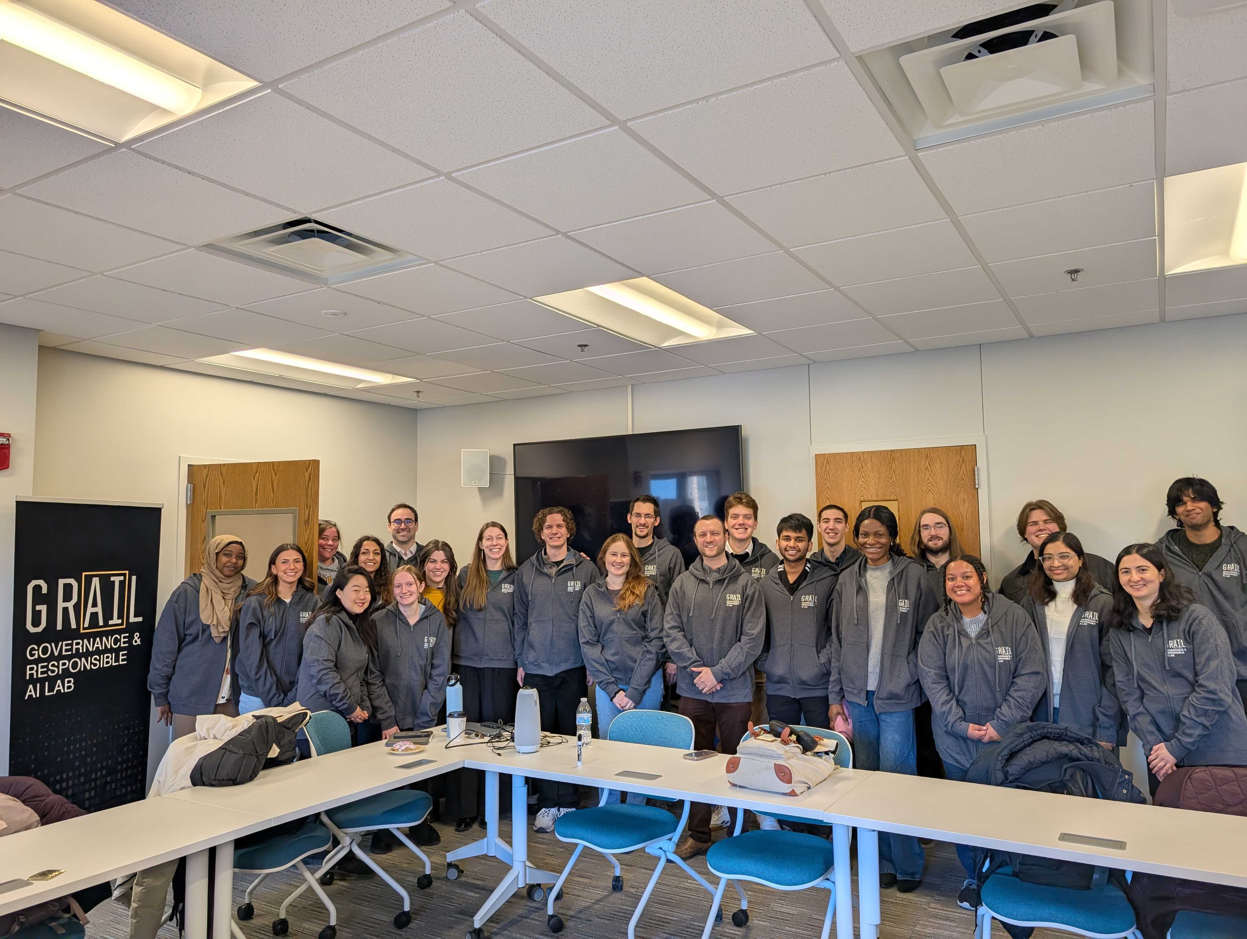 GRAIL members smiling together in the lab meeting room